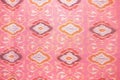 Close up pink silk handicraft,Fabric fashion design,Beautiful Thai style fabric pattern background ,Texture of Thai cloth