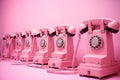 Close up of pink telephones on pink background Royalty Free Stock Photo