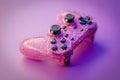 Sparkling pink game controller on a purple background Royalty Free Stock Photo