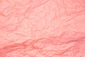 Close up of pink wrinkle crumpled old with paper page texture rough background. crease grunge parchment pattern vintage design