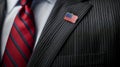 Close-up of a pinstriped suit, red striped tie, and American flag lapel pin Royalty Free Stock Photo