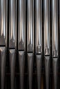 Close-up of a pipes of historic organ in a church . Antique musical instrument