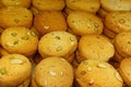 Close up of pistachio cookies with dry fruits arranged in rows