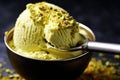 close-up of pistachio gelato scooped with an ice cream spade