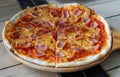 Close-up pizza ham cheese with tomato sources on wooden tray Royalty Free Stock Photo