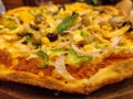 Close-up of a pizza loaded with vegetables