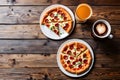 Close-up of a pizza served in a white ceramic plate and cold coffee