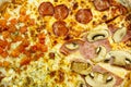 Close up of Pizza Texture. Pizza with ham, cheese, mashrooms, paprika, salami. top view of pizza for any background. Royalty Free Stock Photo