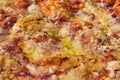 Close-up of pizza topped with cheese and oregano. Macro shot of delicious products.