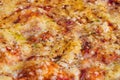 Close-up of pizza topped with cheese and oregano. Macro shot of delicious products.