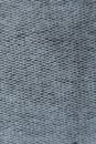 Close up of plain grey fabric from above