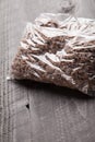 Close up of plastic bags of cooked ground meat.