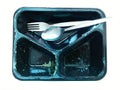 After meals. Plastic box or tray for packing food with leftovers, fork and spoon. Royalty Free Stock Photo