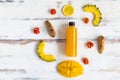 Close up of a plastic bottle of the mixed fruit and vegetable juice by cold pressed with organic ingredients place around on a Royalty Free Stock Photo