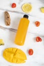 Close up of a plastic bottle of the mixed fruit and vegetable juice by cold pressed with organic ingredients place around on a Royalty Free Stock Photo