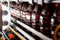 Close up of plastic bottles on a conveyor belt. Industrial production of beer.