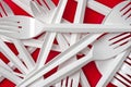 Close-up of plastic Forks on red background. Royalty Free Stock Photo