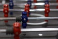 Close-up plastic players in table football in entertainment center. Soccer table with red and blue players Royalty Free Stock Photo