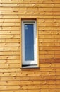 Close up on Plastic PVC Window in New Modern Passive Wooden House Facade Wall.