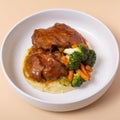 Close-up plate of beef ribs in barbecue sauce with vegetables and mashed potatoes angle view Royalty Free Stock Photo