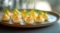 A close-up plate filled with deviled eggs, a popular appetizer or snack. The eggs are halved and filled with a creamy mixture made