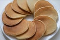 Plate with fresh tasty homemade pancake, hot delicious meal for breakfast Royalty Free Stock Photo