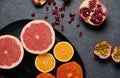 Close up of a plate full of vitamin C fruits on a dark background Royalty Free Stock Photo