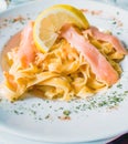 Close-up of plate of pasta and smoked salmon