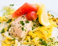 Close-up of plate of pasta and smoked salmon