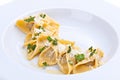 Close-up of the plate of ravioli with grated parmesan.