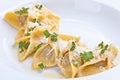 Close-up of the plate of ravioli with grated parmesan.