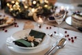 A close-up of plate on table set for dinner meal at Christmas time. Royalty Free Stock Photo