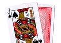 Close up of playing cards with the jack of spades revealed.