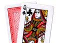 Close up of playing cards with the queen of clubs revealed. Royalty Free Stock Photo