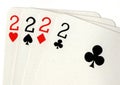 Close up of playing cards showing four twos.