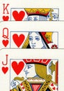 A close up of playing cards showing a jack, queen and king of hearts. Royalty Free Stock Photo