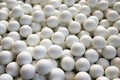 Close-Up of a Plethora of Golf Balls. Mesmerizing Texture of Numerous Spherical Objects