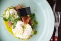 Close-up poached egg with yolk on toast with avocado and salad Royalty Free Stock Photo