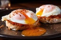 close-up of poached eggs on english muffins