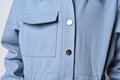 Close-up: a pocket on a denim jacket, overalls, a fragment of a photograph of a girl in a blue jacket with a patch Royalty Free Stock Photo