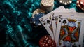 Close-up of a poker game with playing cards and casino chips on a textured table. high stakes and gambling concept Royalty Free Stock Photo