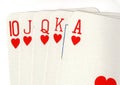 Close up of a poker hand of playing cards showing a royal flush. Royalty Free Stock Photo
