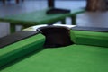 A close-up of a pool table corner pocket, with the green felt and pocket lining Royalty Free Stock Photo