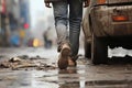 Close-Up of a Poor Man& x27;s Worn Shoes and Legs on Urban Street.