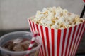 Close-up of popcorn and cold drink