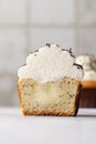 Close-up cut of a poppy seed cupcake cut with cream cheese, vanilla custard and chocolate sprinkles Royalty Free Stock Photo