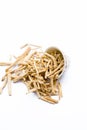 Close up of popular Indian and Asian ayurvedic herb i.e. Satavari or kurilo isolated on white in a glass bowl.