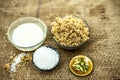 Close up of popular Indian & Asian sweet dish i.e. Malida or churma na ladu or moti chur na ladu in a bowl on brown surface with e