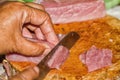 Close up pork is being sliced to pieces, to make a meal. Royalty Free Stock Photo