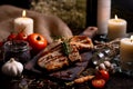 Close up pork chops steak with black pepper sauce placing on vintage wooden plate together with many ingredient Royalty Free Stock Photo